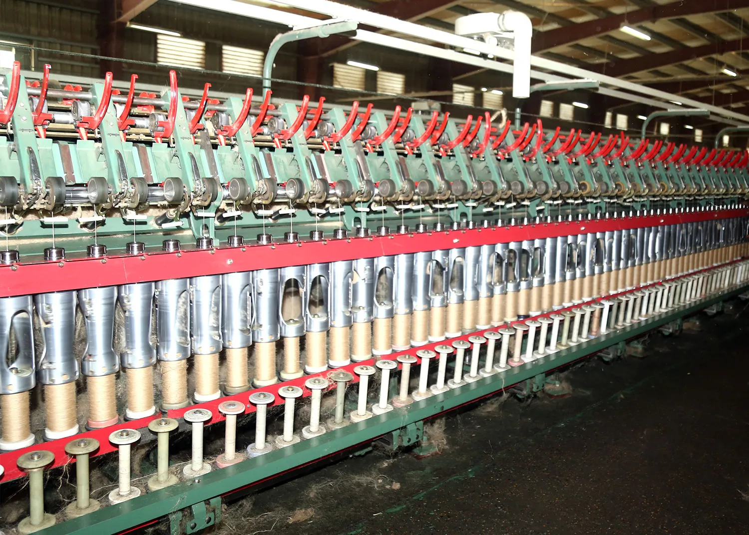 Jute yarn spinning frame with bobbins at Wahab Jute Mills, Khulna Bangladesh